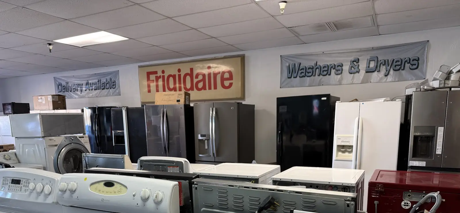Rows of refrigerators, ranges, washers and dryers on the RDM showroom floor